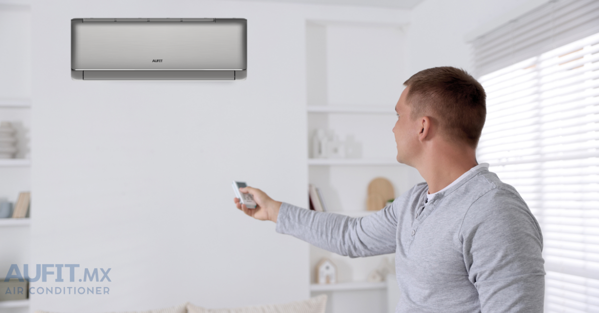 Hombre usando un control remoto para ajustar el aire acondicionado en una sala moderna.